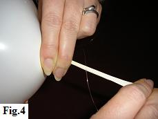 How to tie the balloon neck around a fishing line