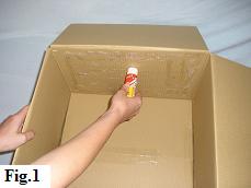 Putting glue on the inside of a balloon box.