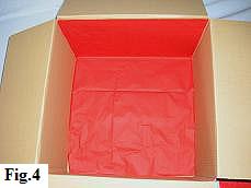 Box almost completely lined with tissue paper