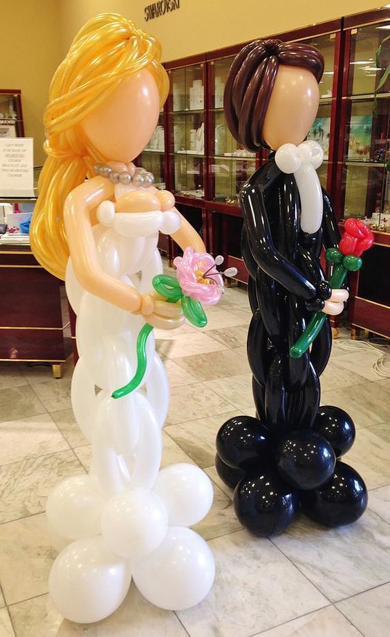 Life sized groom and bride balloon sculptures