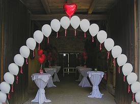 String-of-Pearls balloon arch in white and red