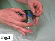 Slipping latex balloon neck over the neck of the bottle that's used as a funnel