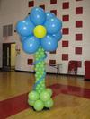 Balloon Column with Flower Topper (Image Credit: www.exclusiveballoons.com)