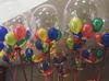 Colorful balloons inside a clear balloon [Image source: balloonsforyou.ie]