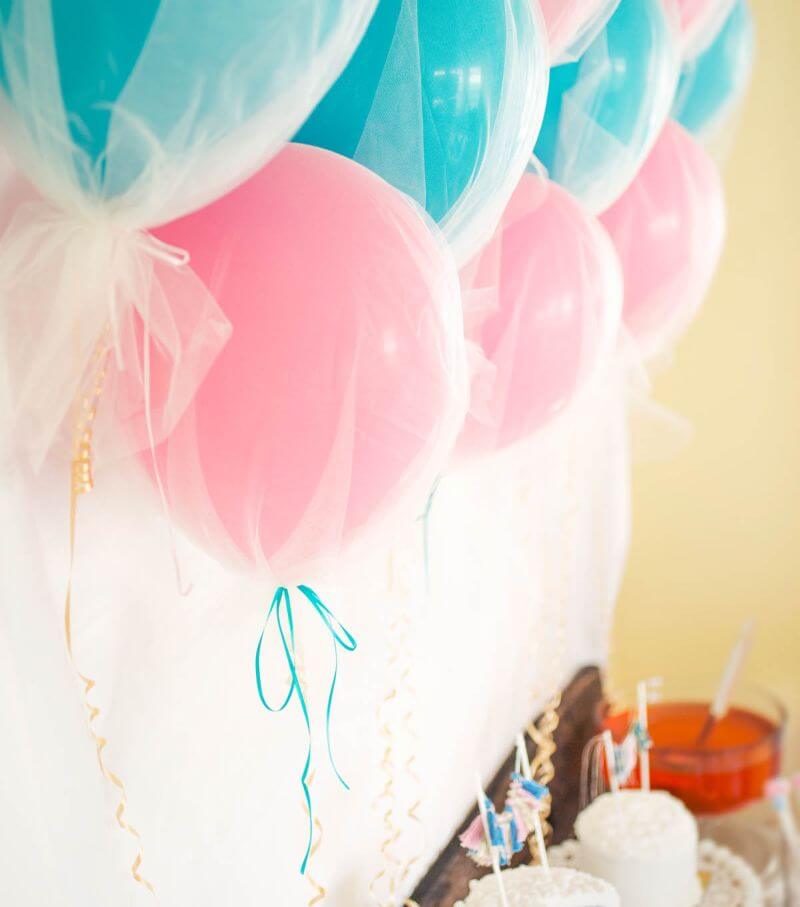 tulle covered balloons in pink and powder blue
