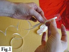 Attaching ribbon to mylar balloon heart Attaching ribbon to mylar balloon heart