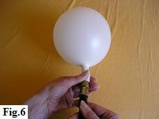 Begin inflating latex balloon with helium. Begin inflating latex balloon with helium.