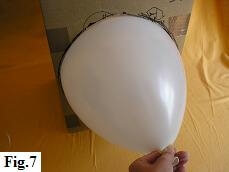Checking size of helium balloon with balloon sizer.
