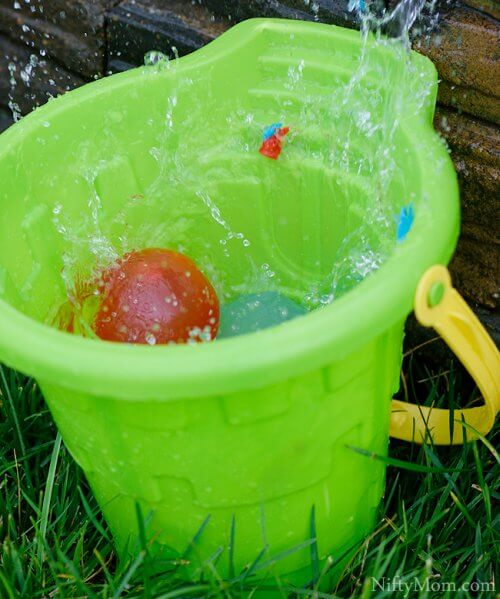 Plastic bucket with water balloons
