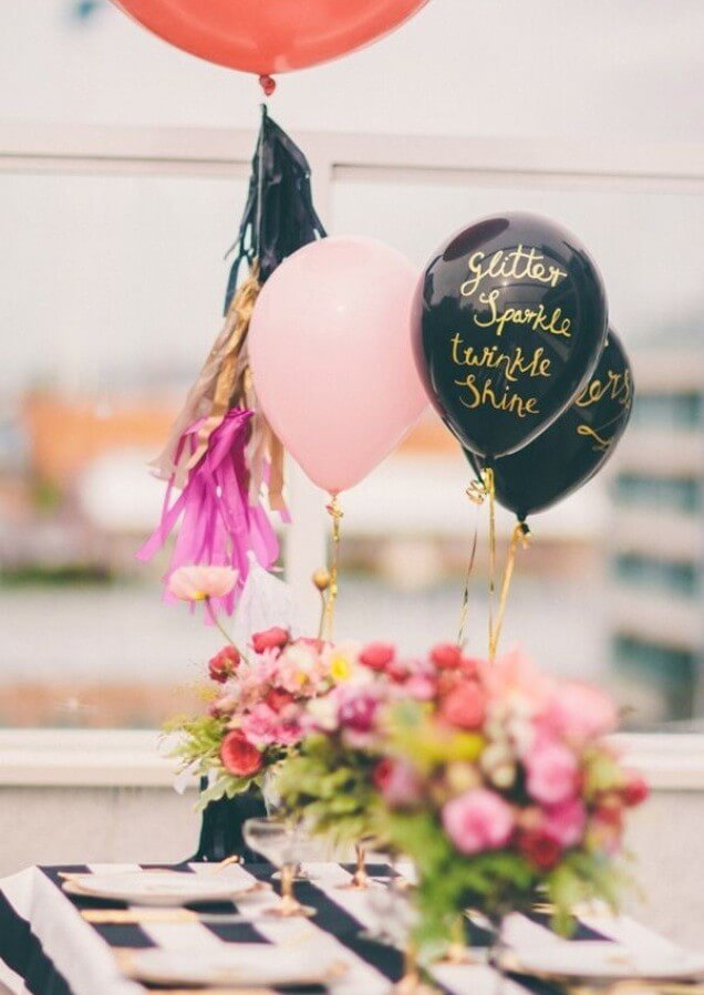 black latex balloons with gold hand writing