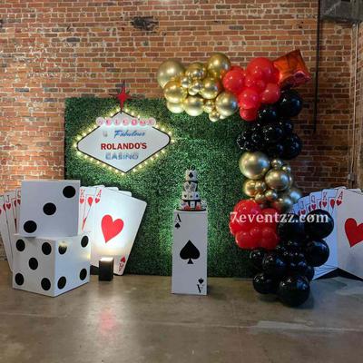 Casino themed balloon decor in red and black