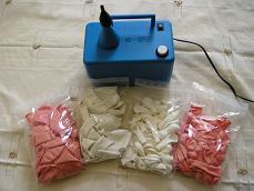 Materials for making a balloon column: balloon inflator and balloons in different colors