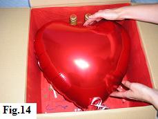 Positioning the mylar balloon heart in the balloon box