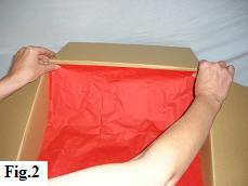 Lining the box with red tissue paper