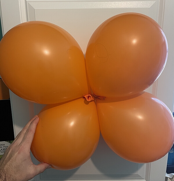 A balloon cluster made of four balloons, also called a quad.