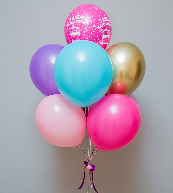 Stacked balloon bouquet with two layers of four balloons and one balloon at the top
